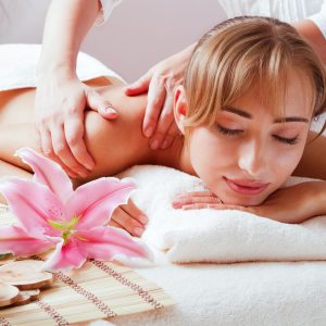 Massage and body care. Spa body massage woman hands treatment. Woman having massage in the spa salon for beautiful girl